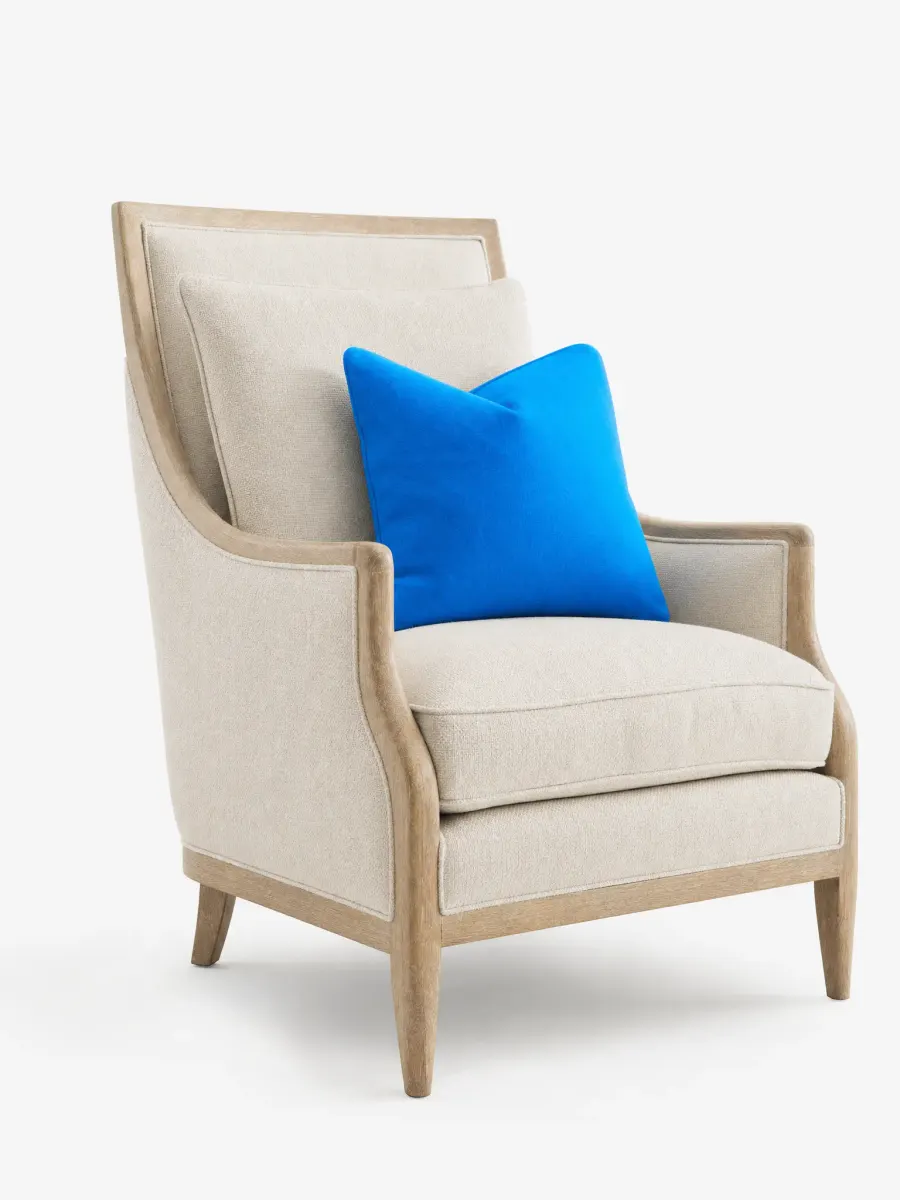 A cream upholstered armchair on a plain white background