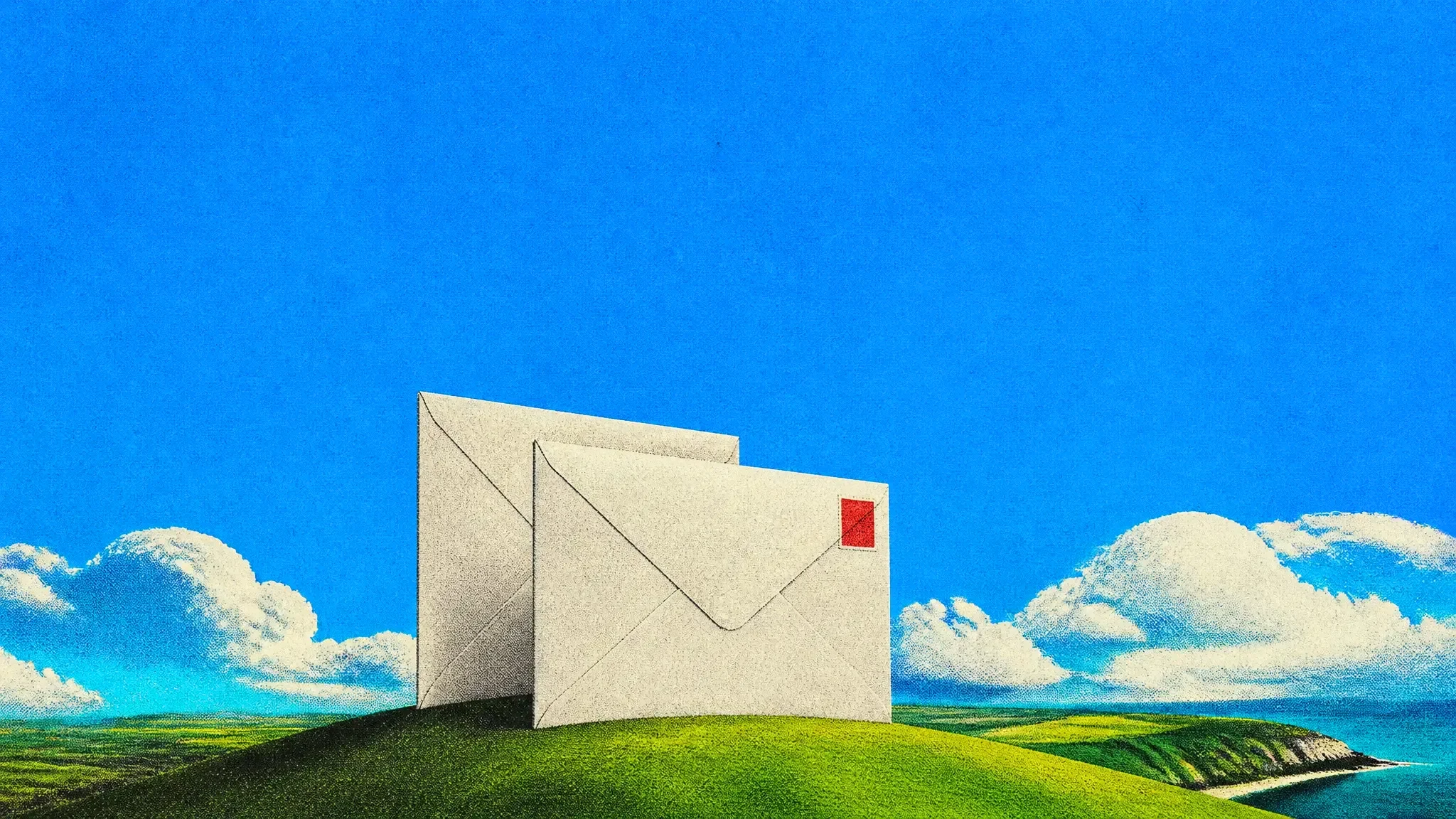 Two giant envelopes standing one behind the other on a green hill