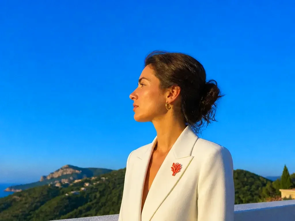 A woman in profile on a rooftop