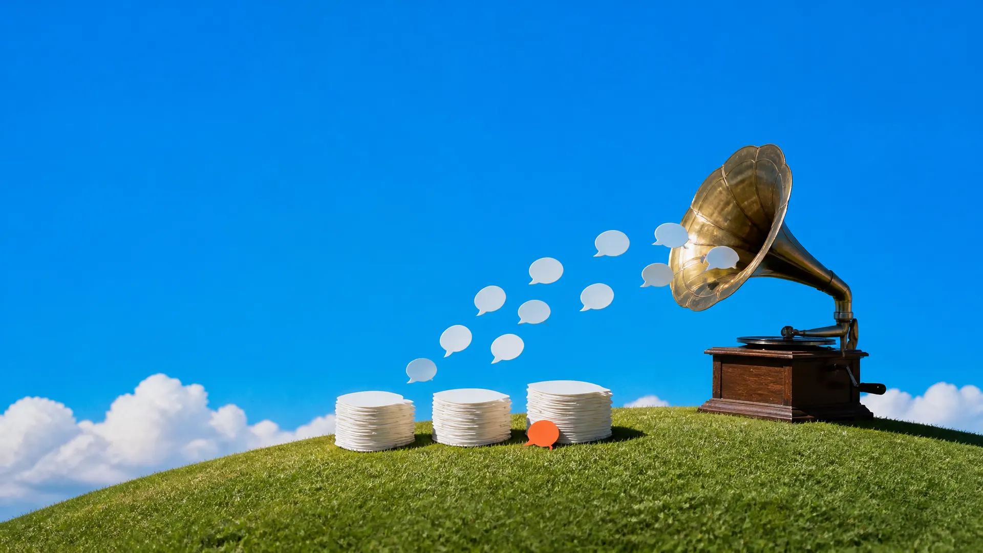 A brass gramophone on a hill sending out blank speech bubbles that settle into three stacks, one bubble orange.