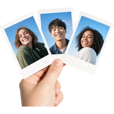Three instant portrait photos fanned in a hand