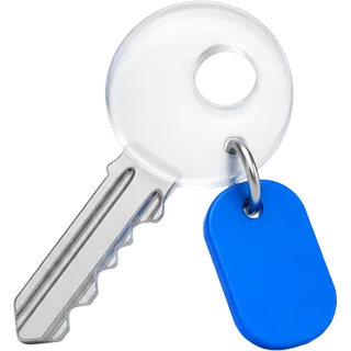 A key with a frosted glass bow and a blue tag