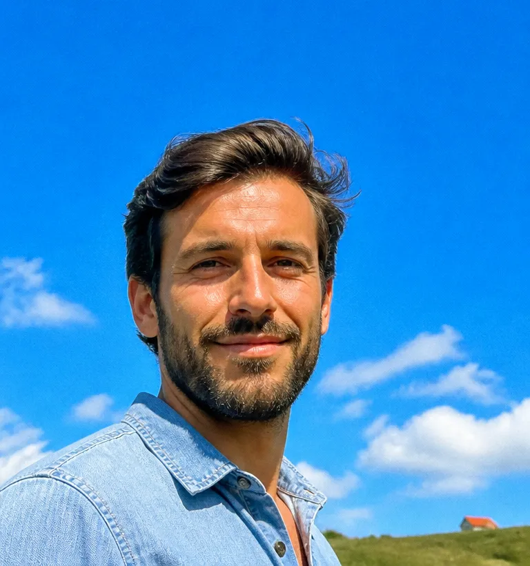Outdoor headshot against an open blue sky