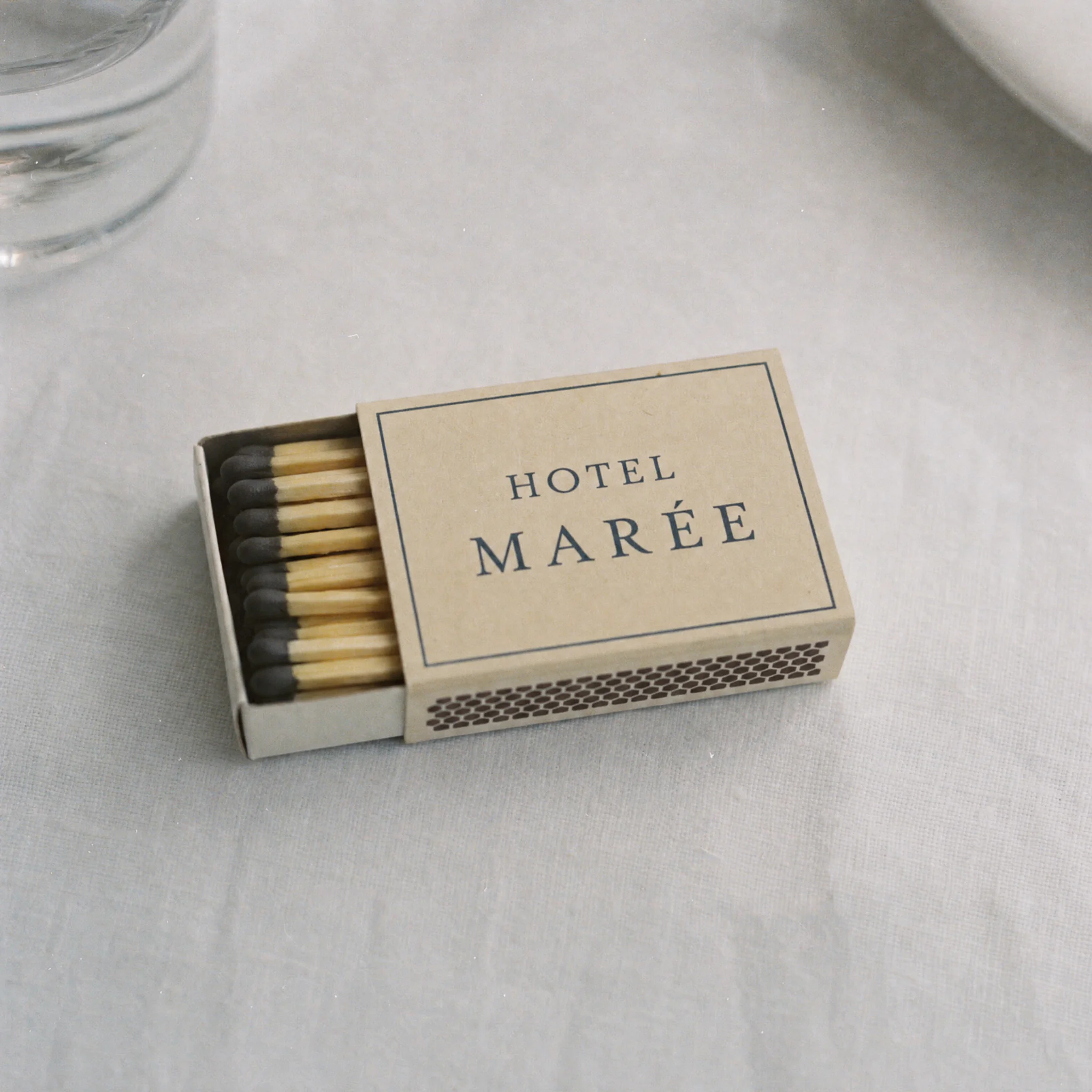 A matchbox printed with the words Hotel Marée