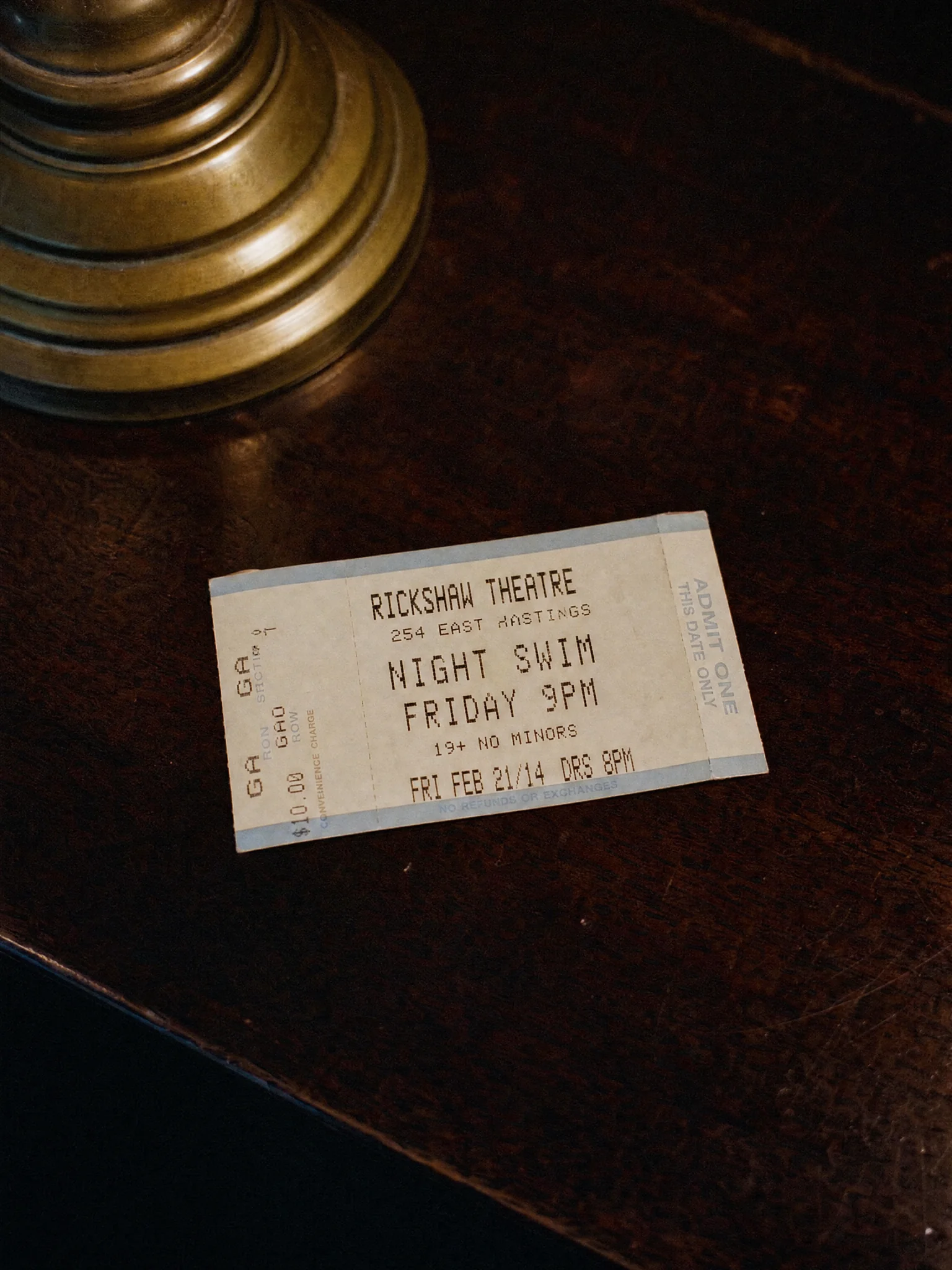 A concert ticket reading Night Swim, Friday 9pm