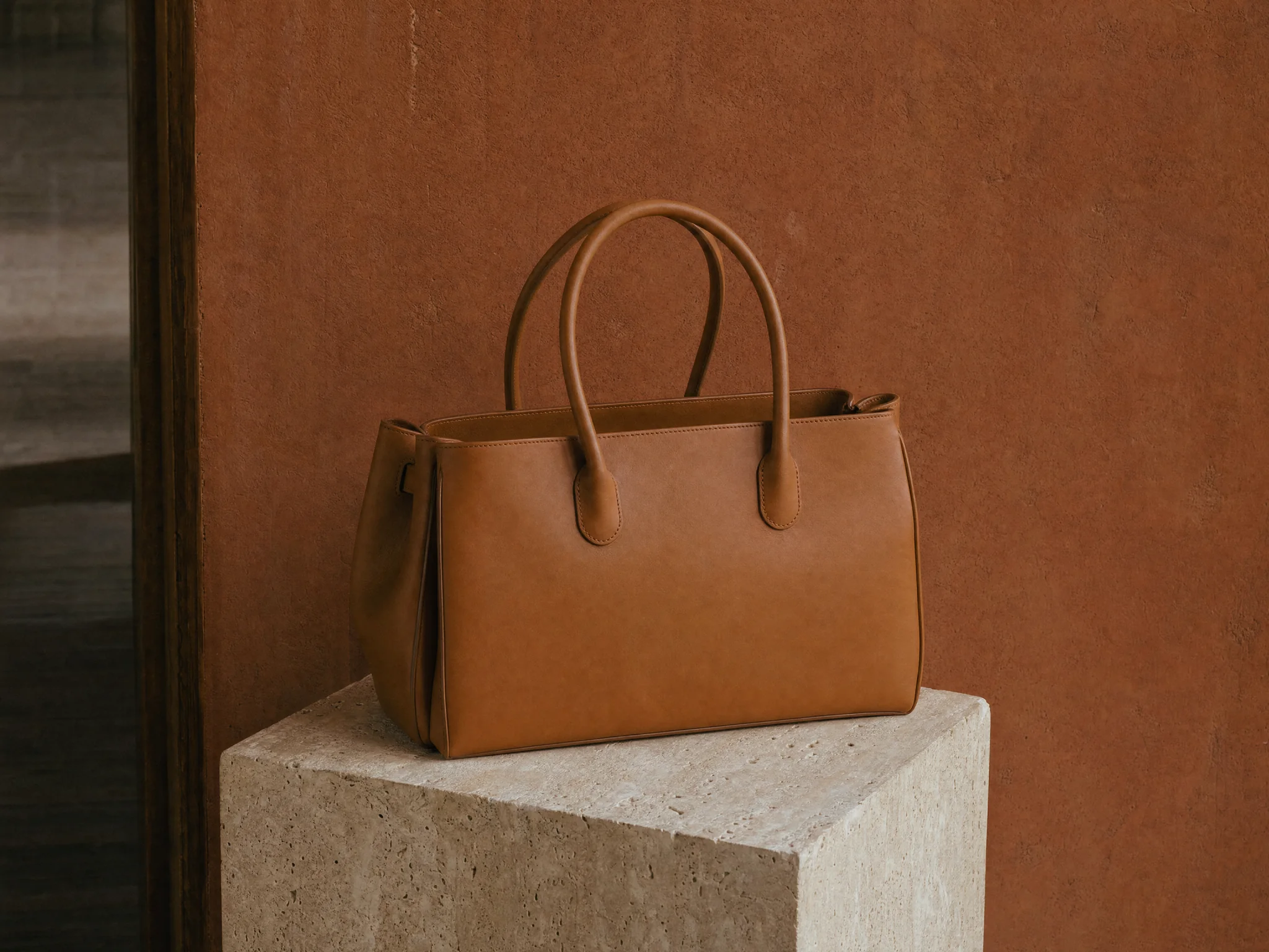A handbag on a pedestal, campaign still