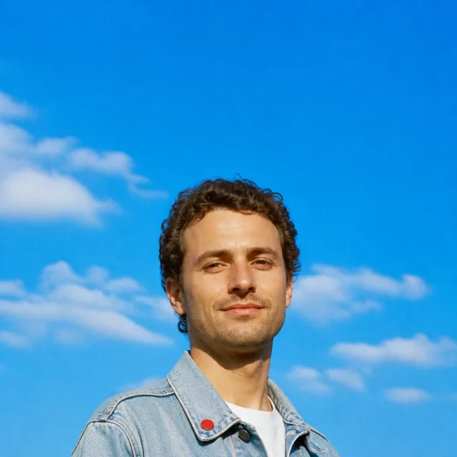 A portrait in daylight under a blue sky